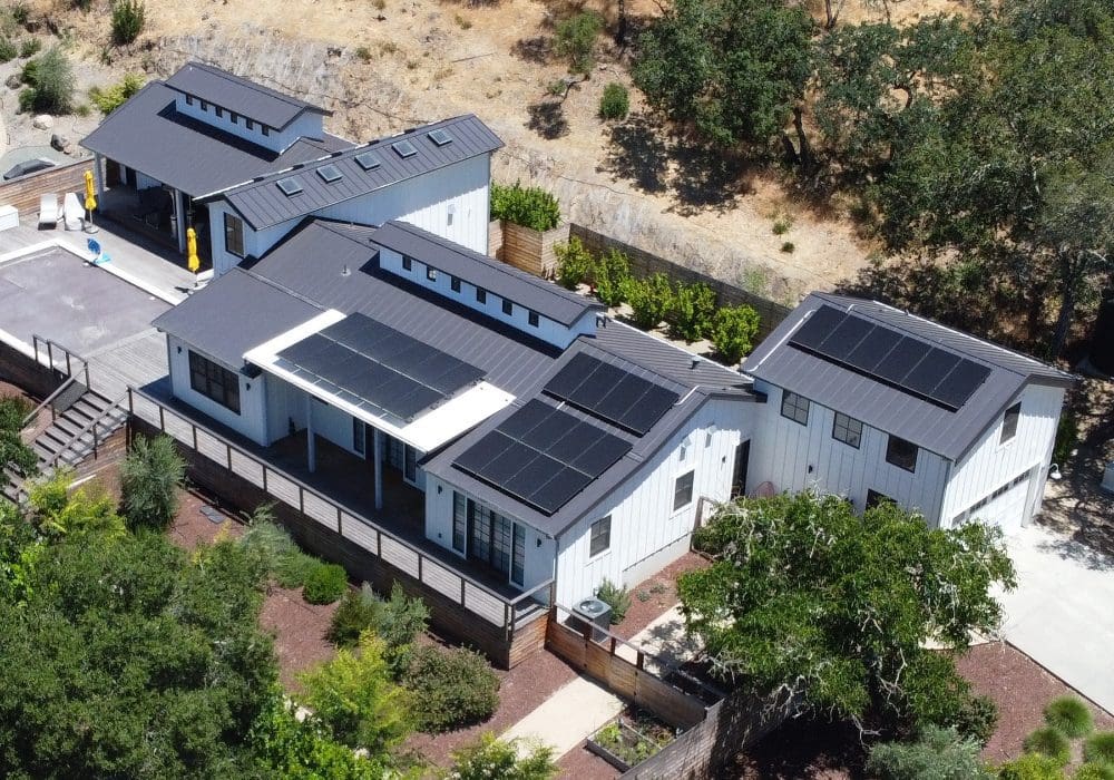 large home with solar panels on roof