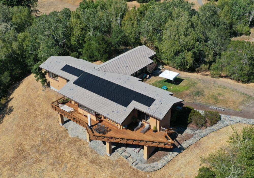 drone view of home with solar panels