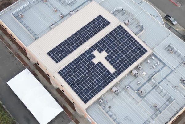 solar panels on roof of church in shape of cross