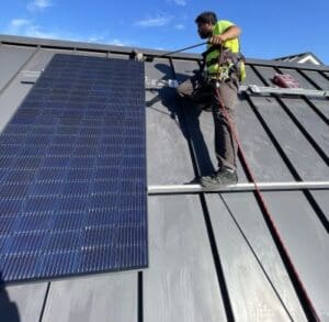 solar installer on roof