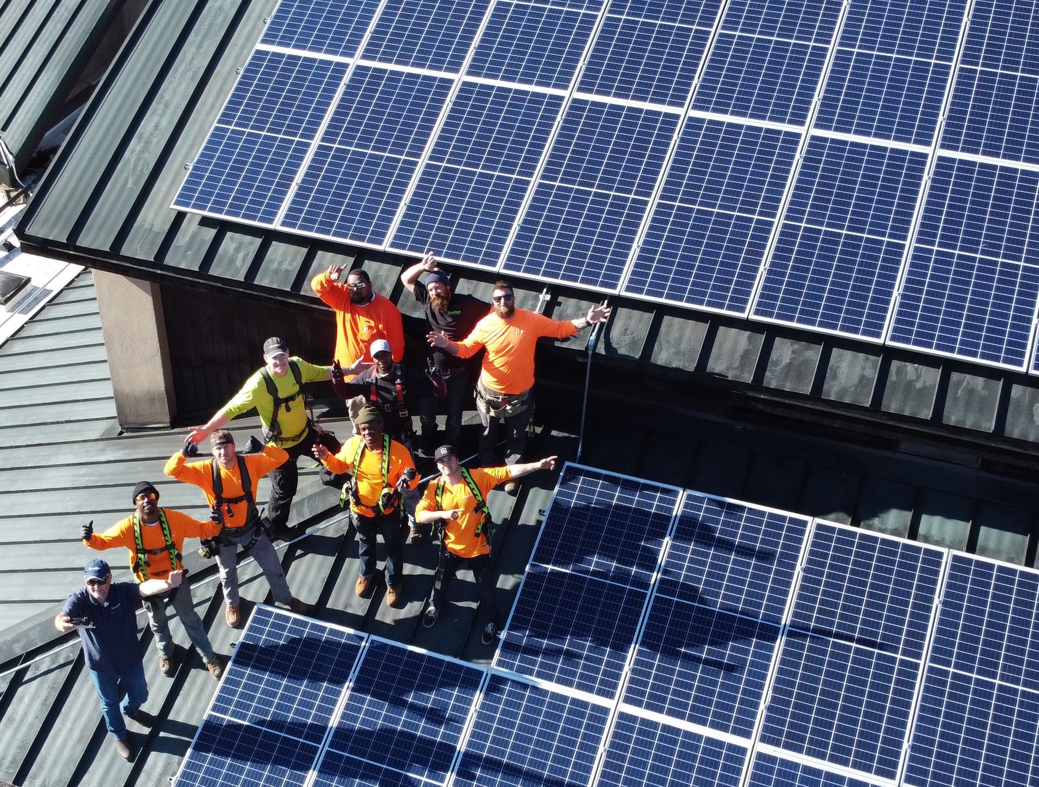 solar installers on roof